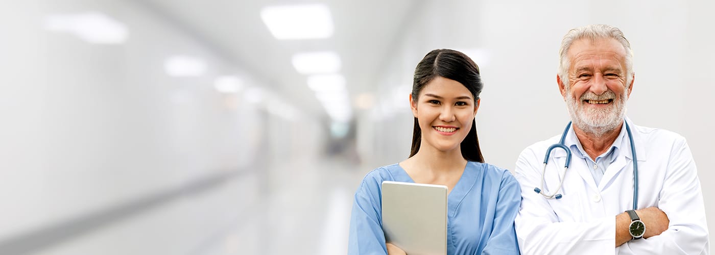 A Trustbridge hospice and palliative medicine fellow in conversation with a colleague