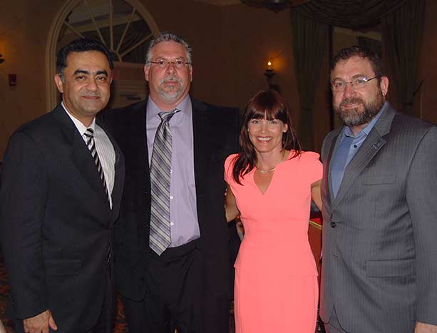 Elizabeth Gundersen, MD standing with three fellowship colleagues at a Trustbridge fellowship event