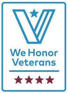 The We Honor Veterans partner badge, showing a stylised blue V with a star above the programme name and four stars beneath it